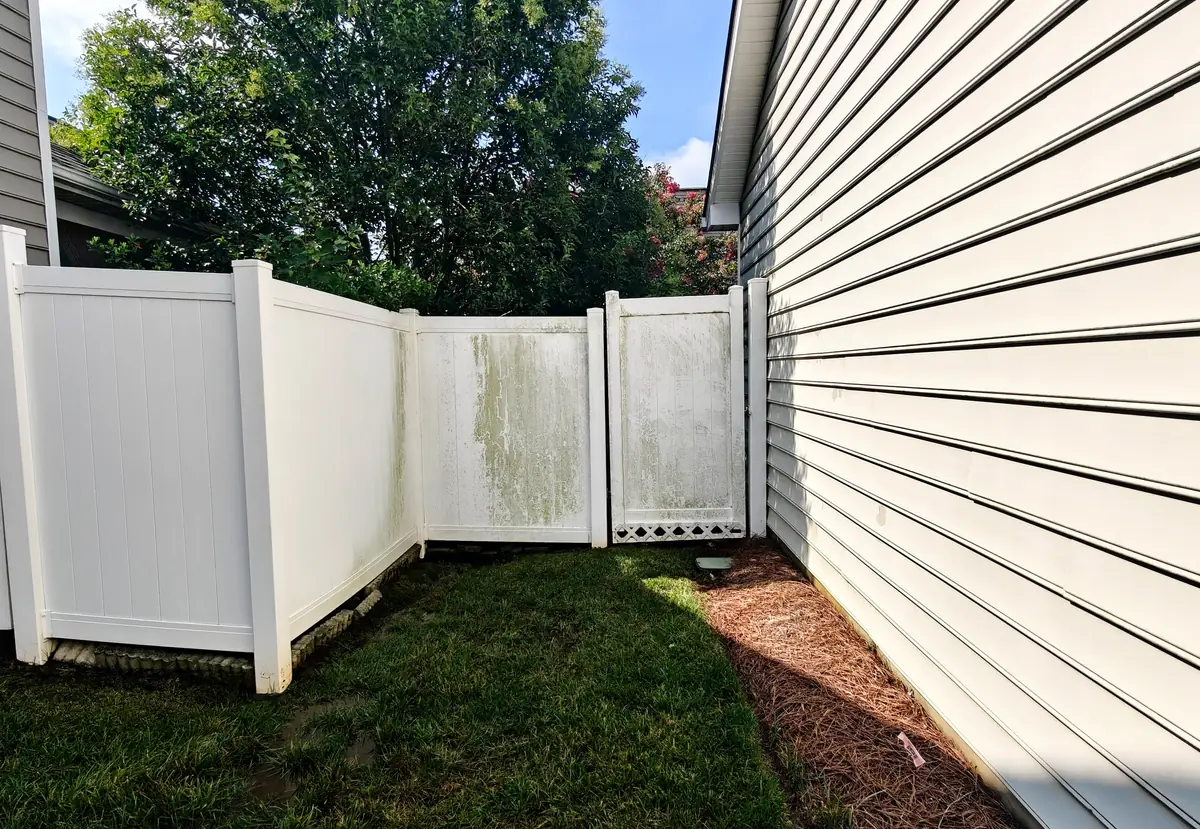 Fence washing — Concord, NC (before) by Soft Touch Softwash