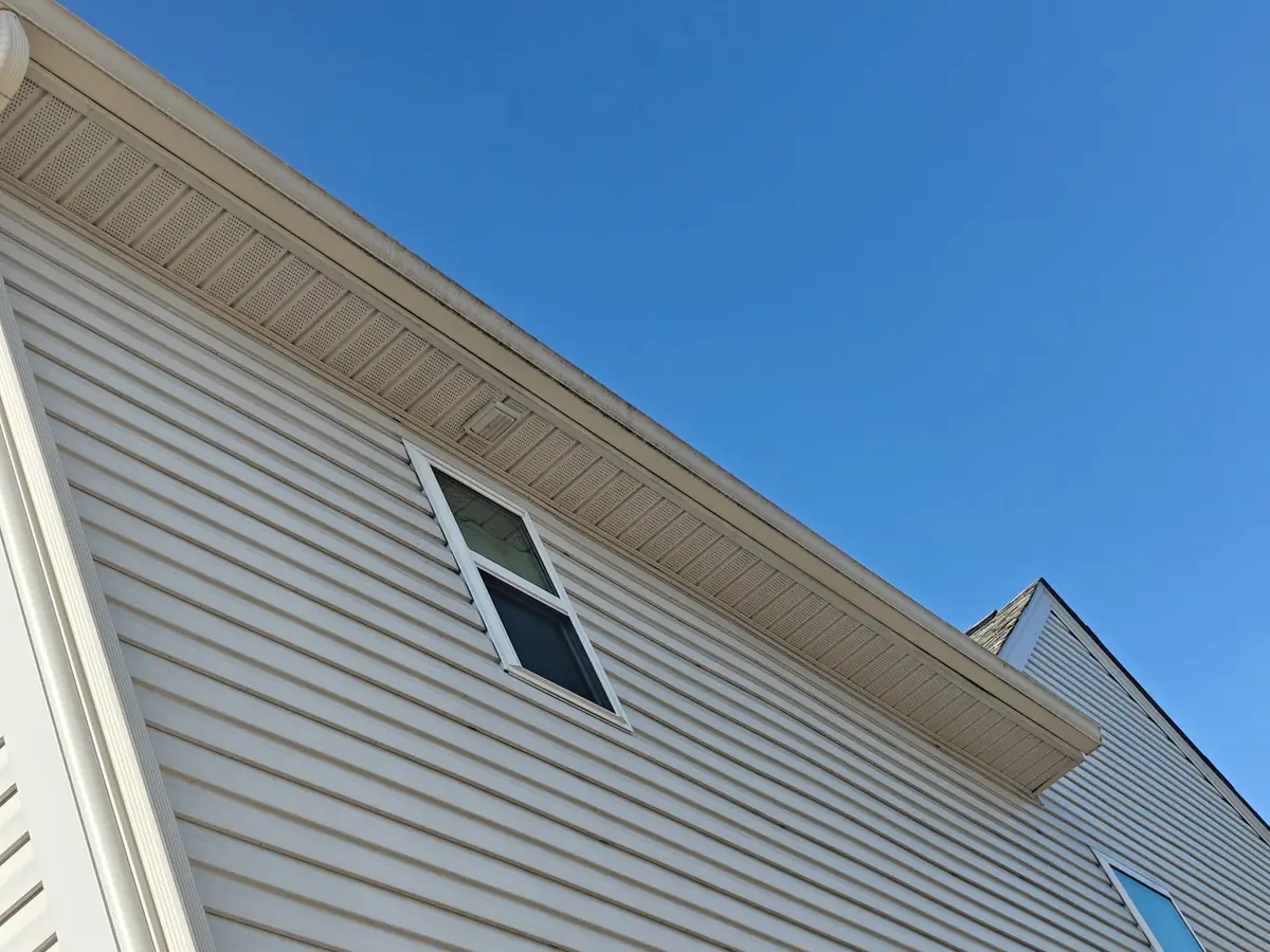 Clean soffit, gutter line and siding on a home in Concord, NC after gutter brightening